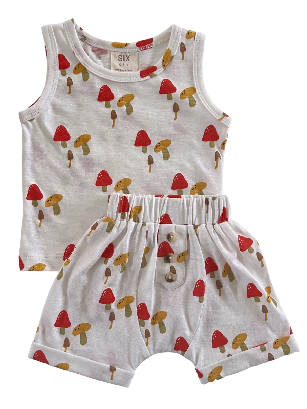 Infant outfit featuring a sleeveless top and shorts with colorful mushroom patterns on a white background.
