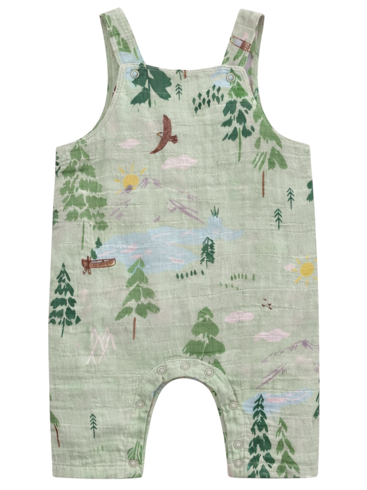 Green toddler overalls featuring a nature print with trees, sun, mountains, and a canoe design.