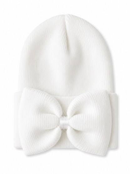 White knit beanie with a large bow on the front, perfect for cold weather.