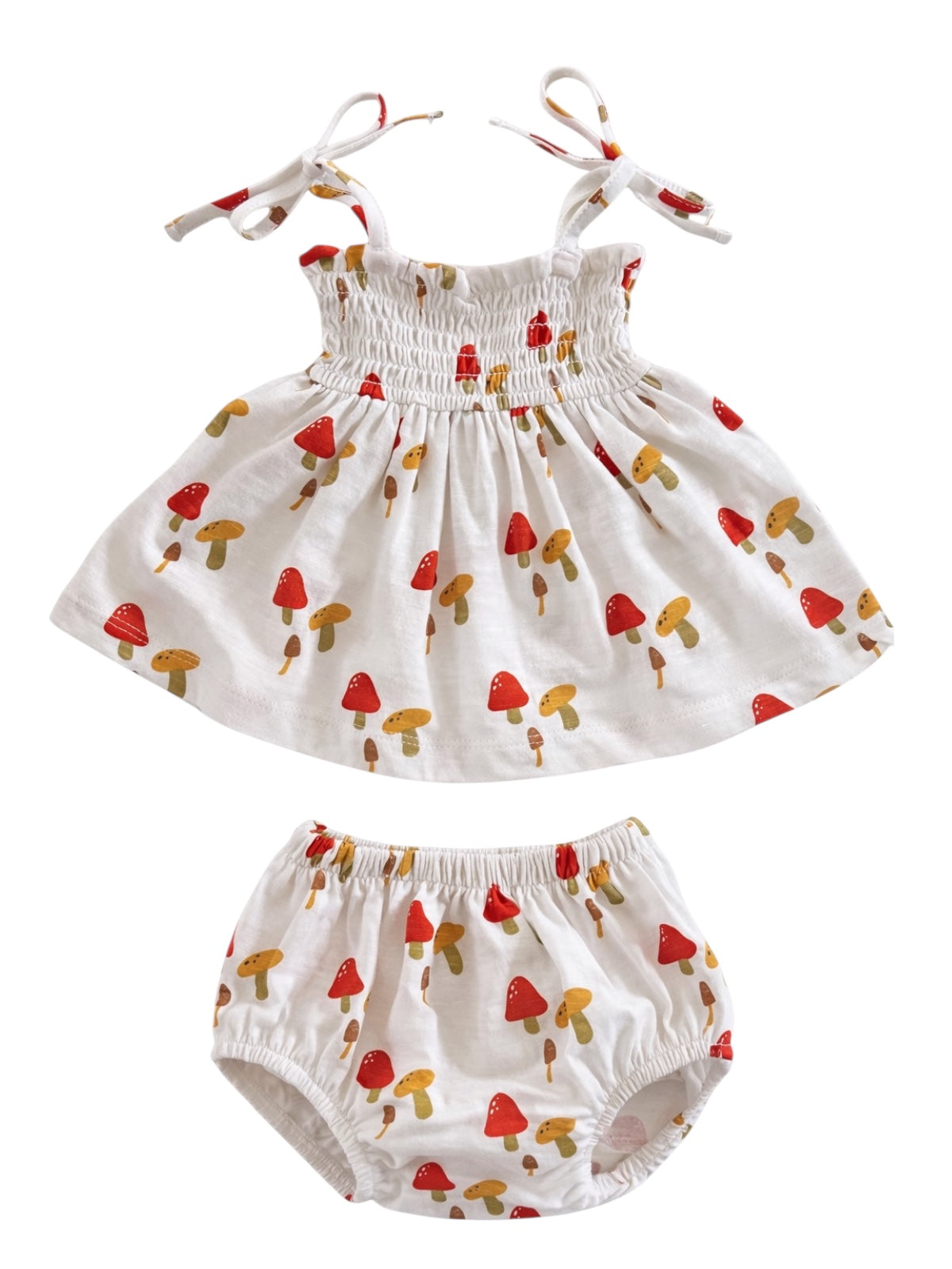 Toddler outfit featuring a sleeveless dress and matching bloomer, decorated with a red and yellow mushroom print.
