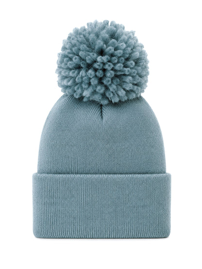 Light blue knit beanie with a large pom-pom on top, perfect for winter wear and casual style.