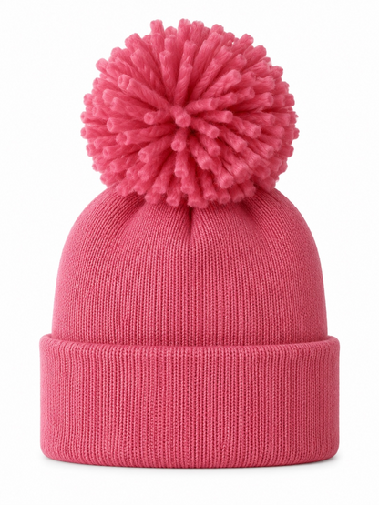 Pink knit beanie with a large pom-pom on top, perfect for winter wear or casual outings.
