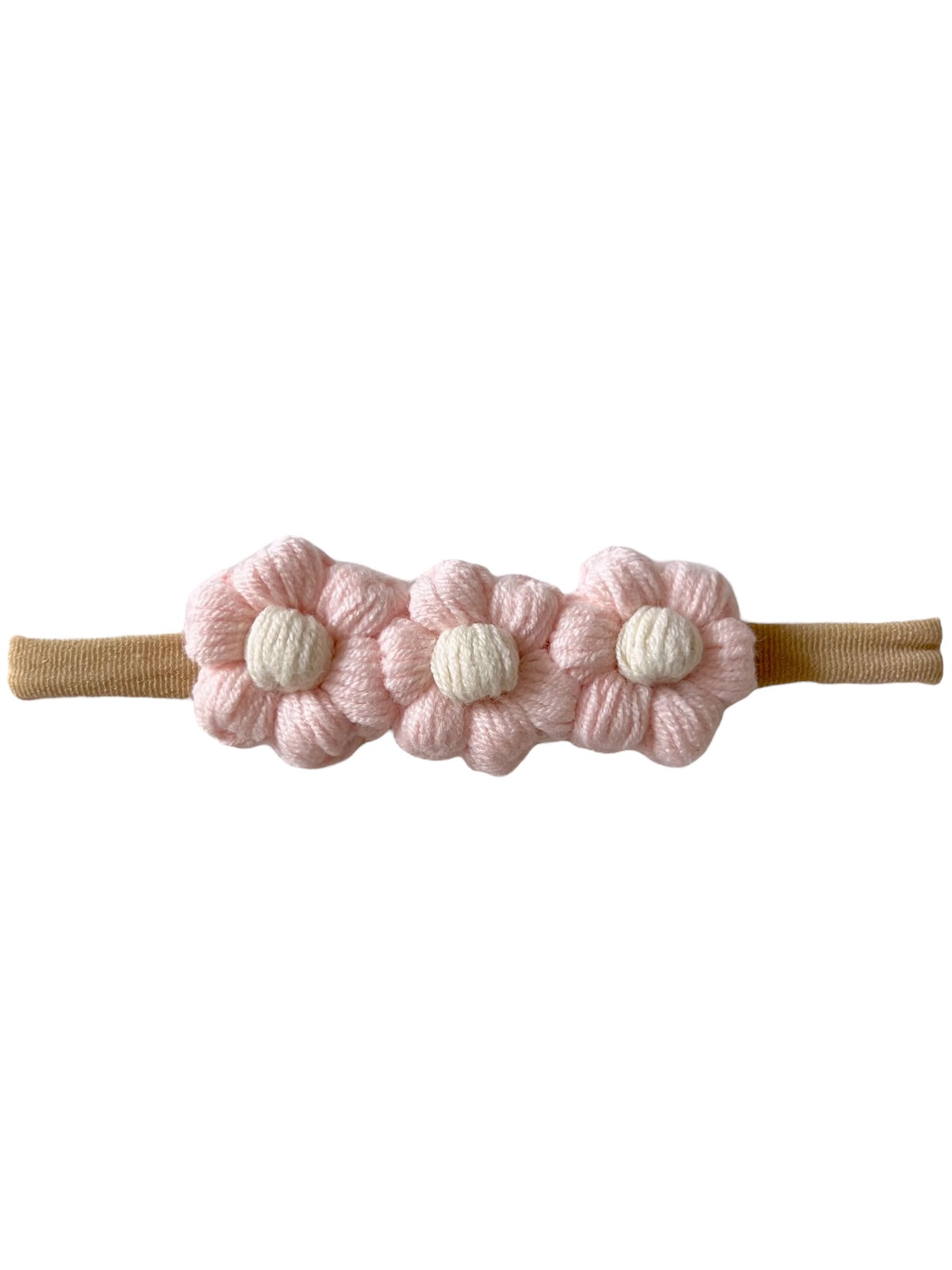 Pink flower hairband with three fabric flowers and a tan elastic strap. Ideal for children’s hair accessories.