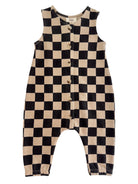Black and beige checkered sleeveless romper with buttons down the front.