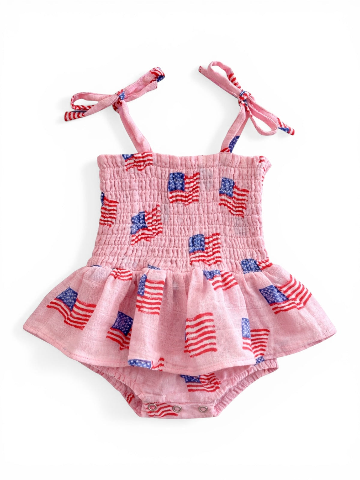 Pink dress with U.S. flag print, featuring straps and a flared skirt, designed for infants.