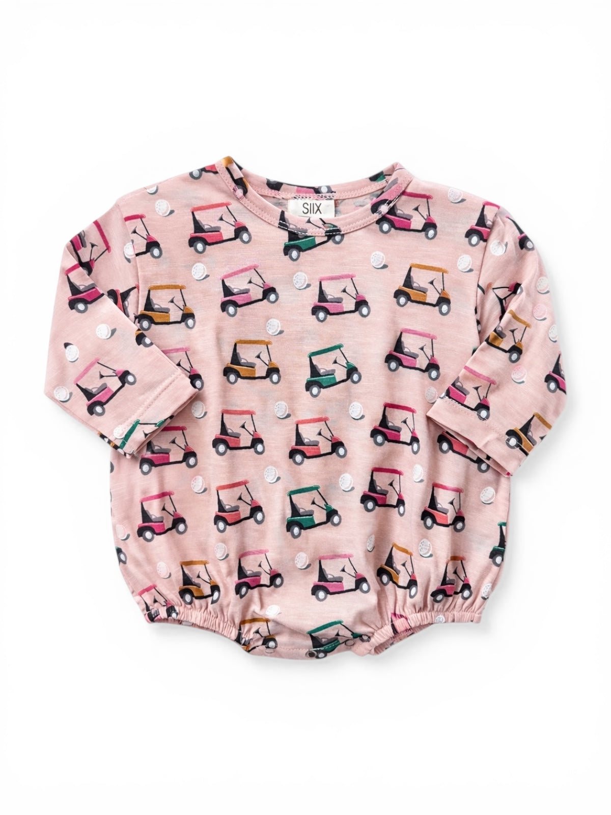 Pink baby shirt with a playful golf cart pattern and short sleeves. Perfect for casual wear.