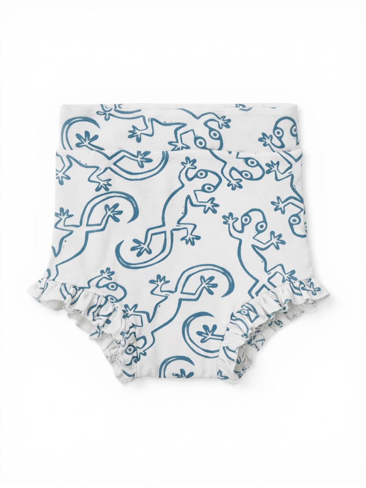 White diaper cover with blue lizard pattern and ruffled edges. Suitable for babies and toddlers.
