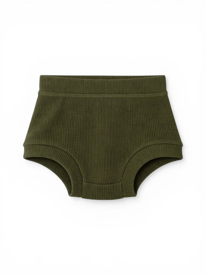 Green ribbed cotton shorts for toddlers, featuring an elastic waistband and comfortable fit.