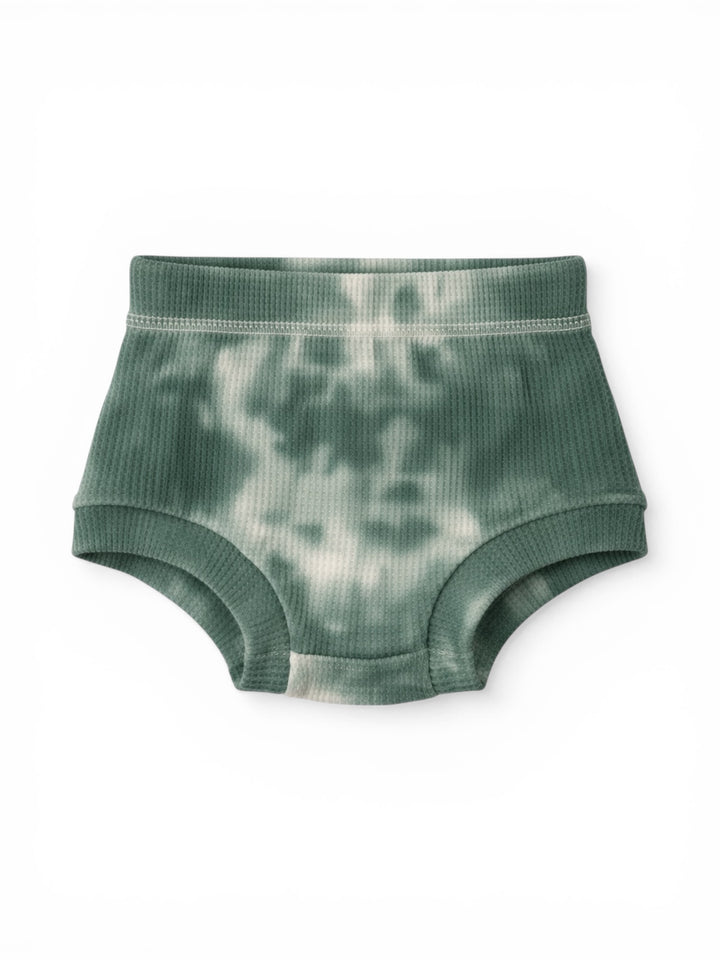 Green tie-dye baby shorts on a white background. Soft ribbed texture, classic design for comfort.