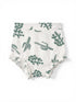 White fabric diaper cover with green cactus patterns and ruffled edges.