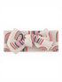 Beige headband with colorful rainbow patterns and a large bow at the center.