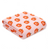 Folded kitchen towel featuring a pink background with orange pumpkin patterns. Perfect for seasonal decor.