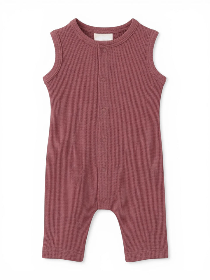 Light purple sleeveless baby romper featuring a button-down front and ribbed texture. Ideal for warm weather.