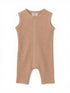 Tan ribbed baby romper with shoulder snaps and short legs, ideal for warm-weather outfits.