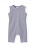 Light blue sleeveless baby onesie with buttons down the front and textured fabric.