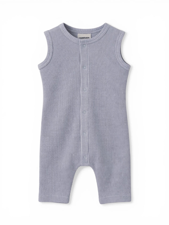 Light blue sleeveless baby onesie with buttons down the front and textured fabric.