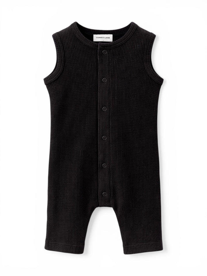 Black sleeveless ribbed romper with buttons, designed for infants and toddlers. Soft, comfortable fabric.