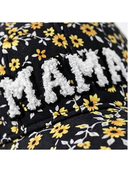 Black floral cap featuring a white textured "MAMA" inscription. Ideal for casual wear.