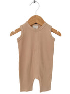Beige sleeveless baby romper on a wooden hanger, featuring a ribbed texture and button closure.