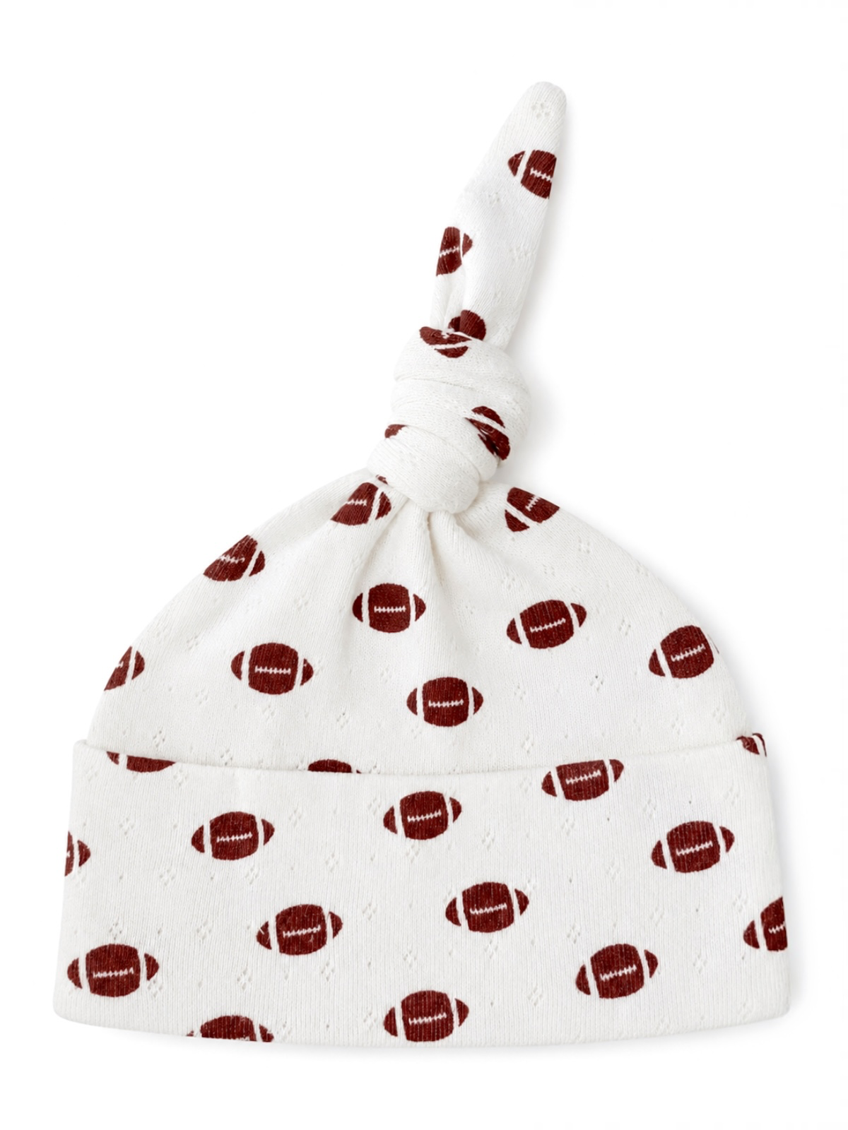 White baby hat with football pattern and a knotted top.