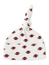 White baby hat with football pattern and a knotted top.