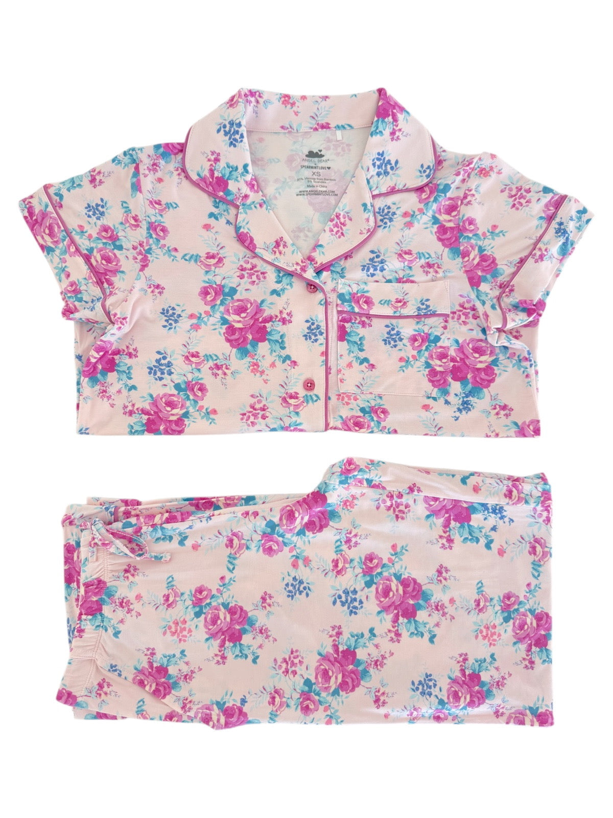 Pajama set featuring a floral pattern in pink and blue with a short-sleeve top and matching pants.