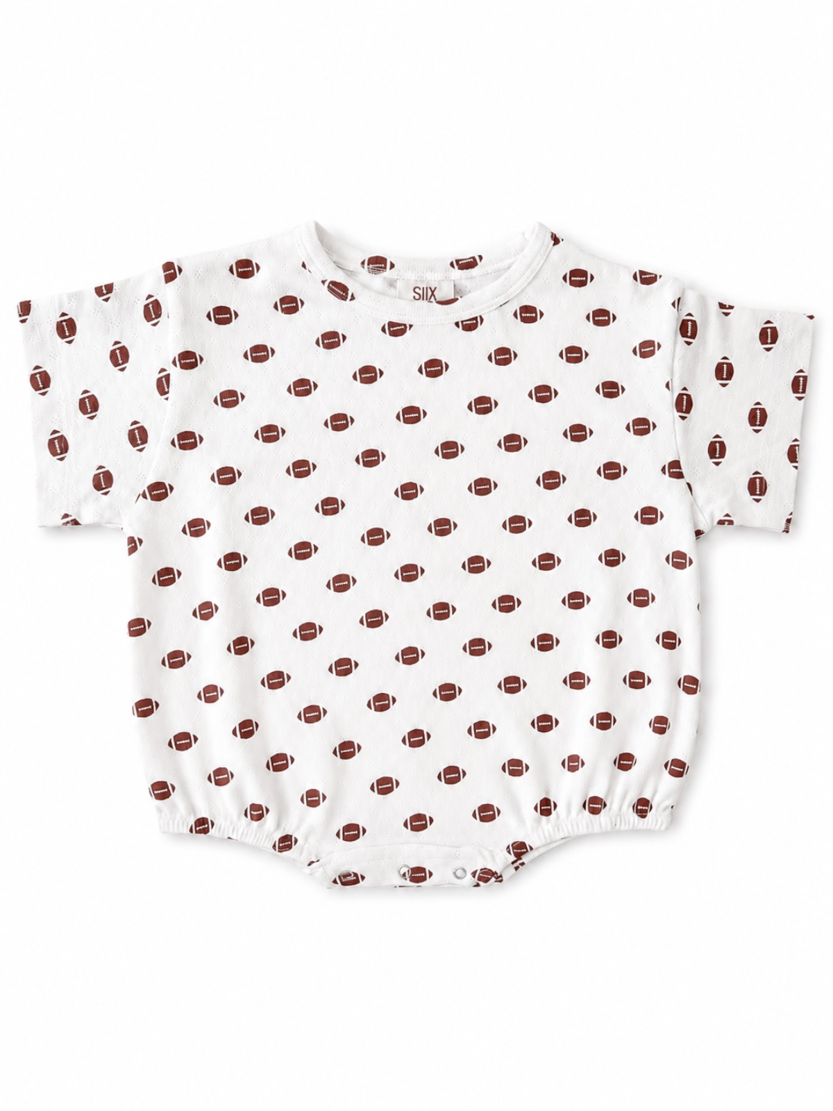White baby onesie with a football pattern, featuring short sleeves and snap closure at the bottom.