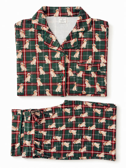 Green plaid pajamas featuring playful dog prints, neatly folded and displayed.