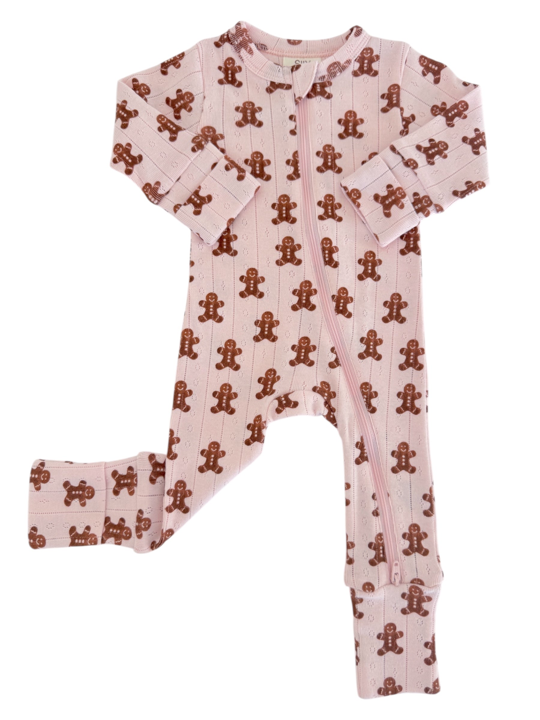 Pink onesie pajamas with gingerbread man patterns, featuring a front zipper and long sleeves.