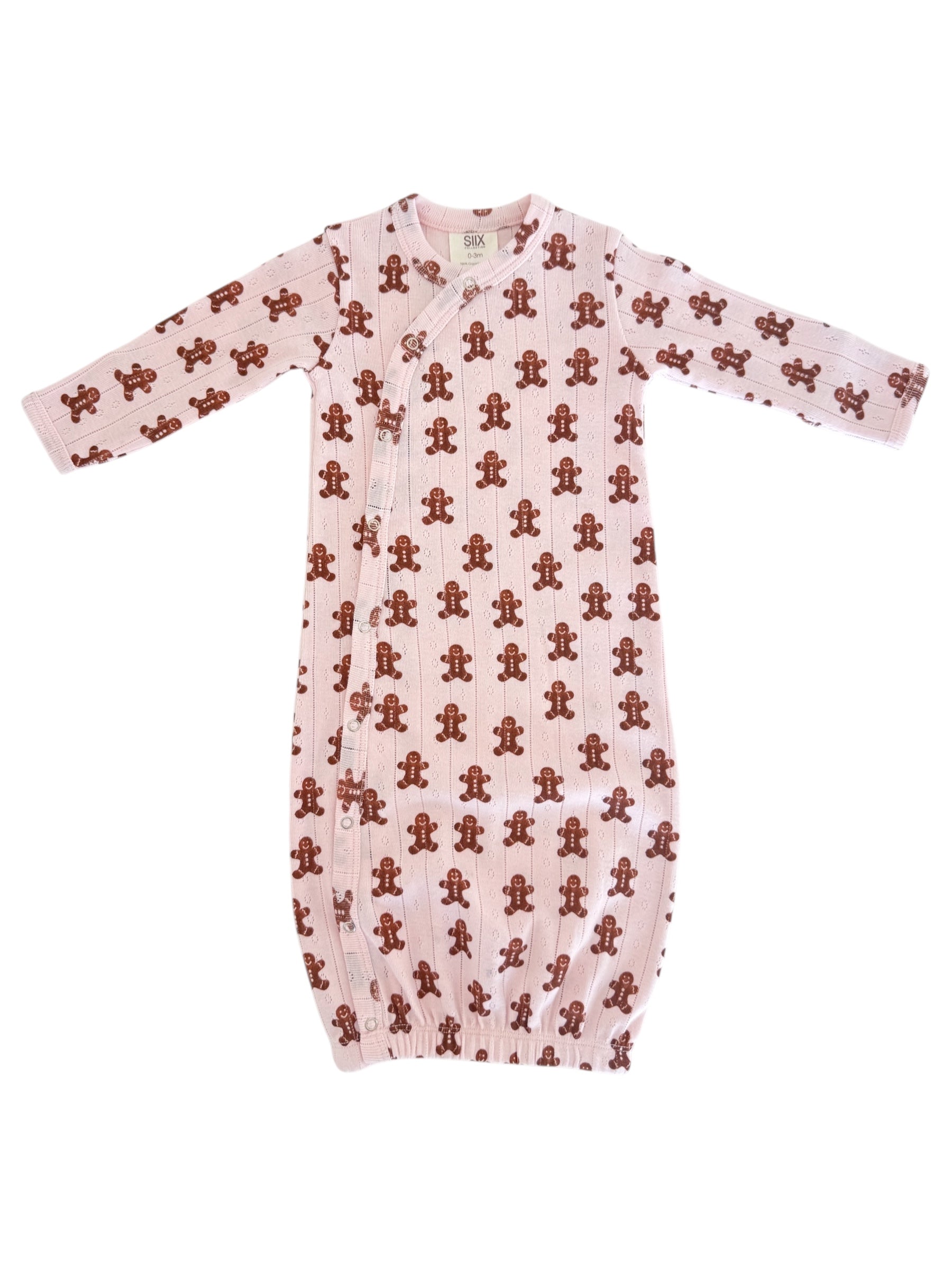 Pink baby sleeper gown with brown gingerbread man print and long sleeves, featuring snap buttons along the side.