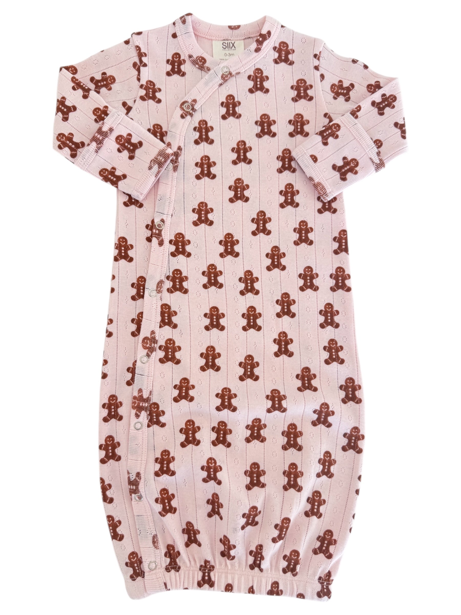Pink baby gown with brown gingerbread man patterns, featuring snap buttons and long sleeves.