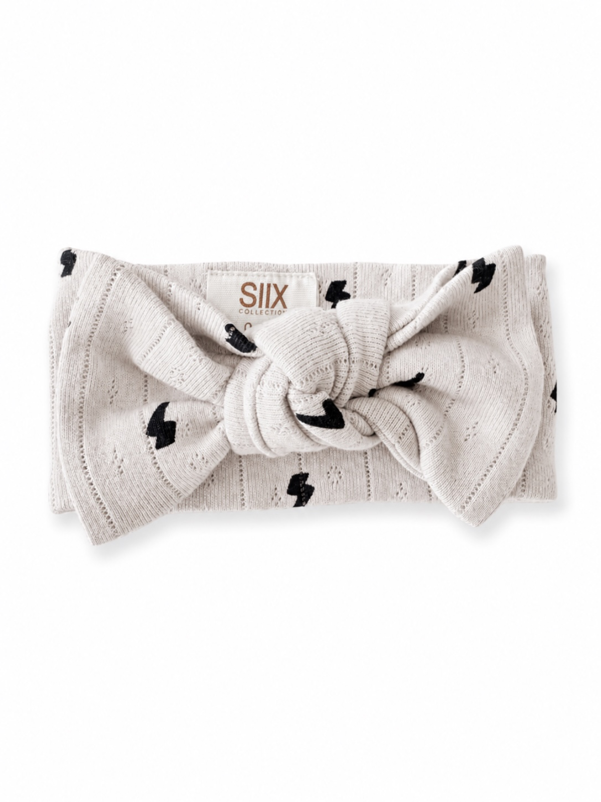 Light gray headband with black lightning bolt pattern and knot detail, branded with "SIIX COLLECTION" logo.