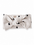 Light gray headband with black lightning bolt pattern and knot detail, branded with "SIIX COLLECTION" logo.