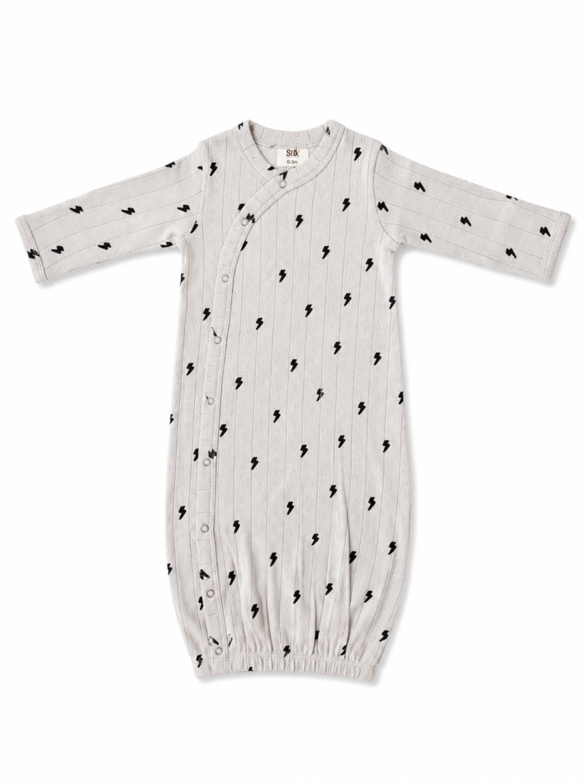 Light gray baby gown with black lightning bolt patterns and snap buttons along the side, suitable for newborns.