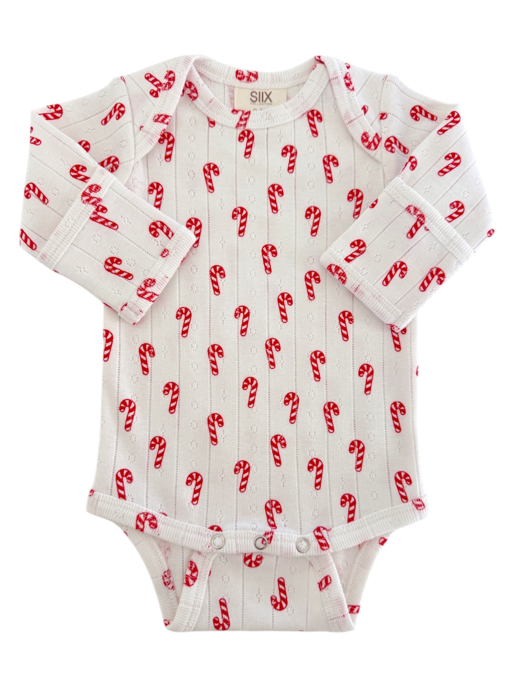 White baby onesie with red candy cane patterns, perfect for festive occasions. Long sleeves and button closures at the bottom.