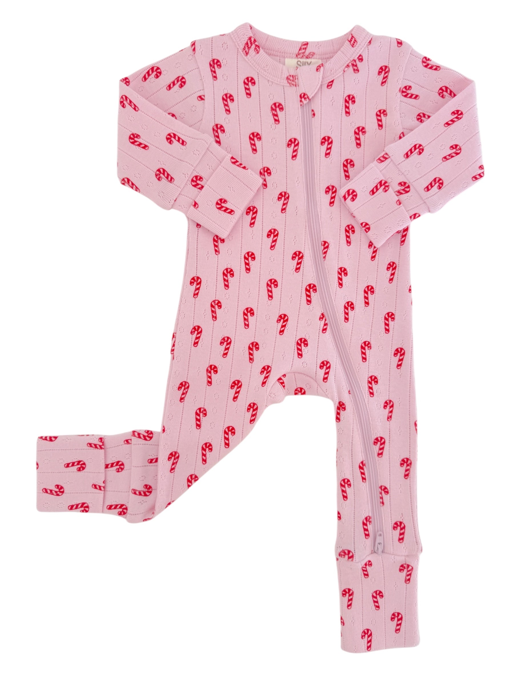Pink children's pajama set featuring a candy cane pattern on a soft fabric.