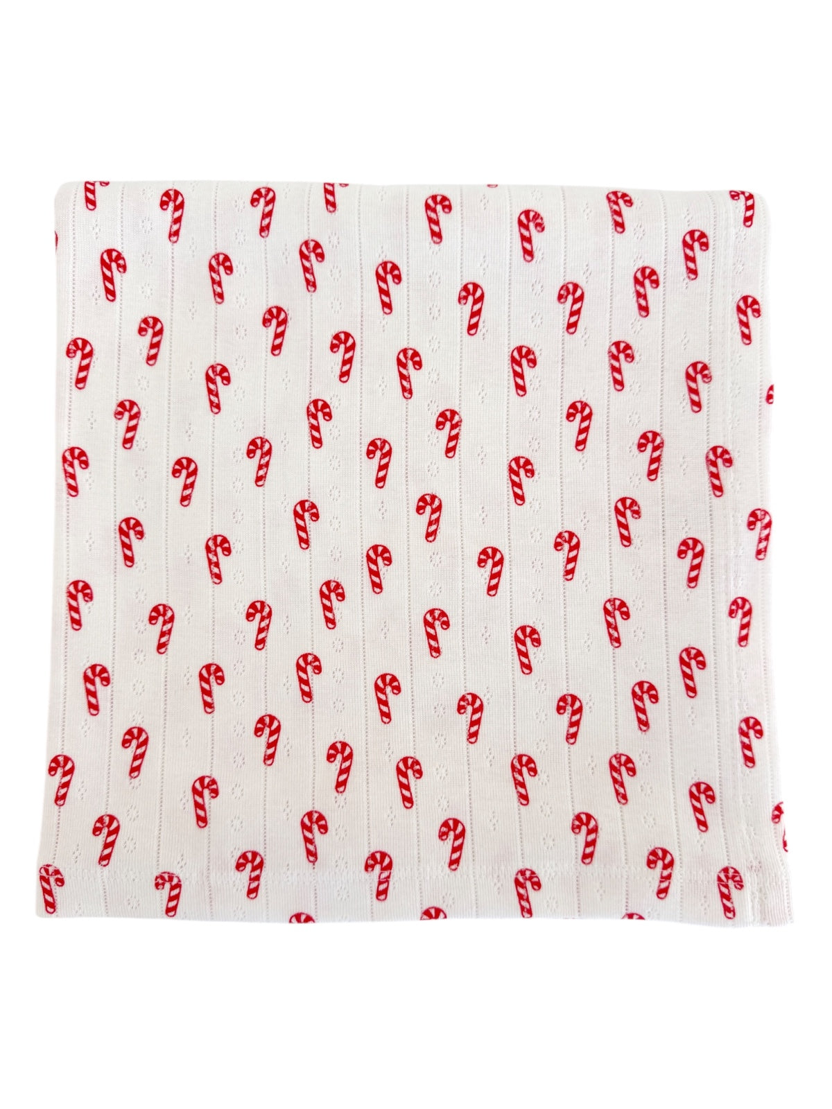 White fabric with repeating red and white candy cane patterns.