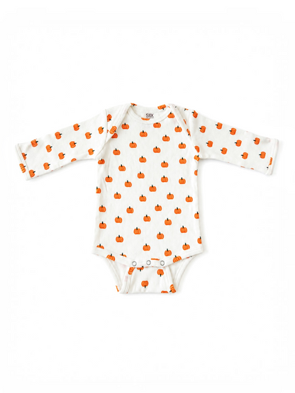 White long-sleeve onesie with a pattern of small orange pumpkins. Perfect for fall or Halloween.