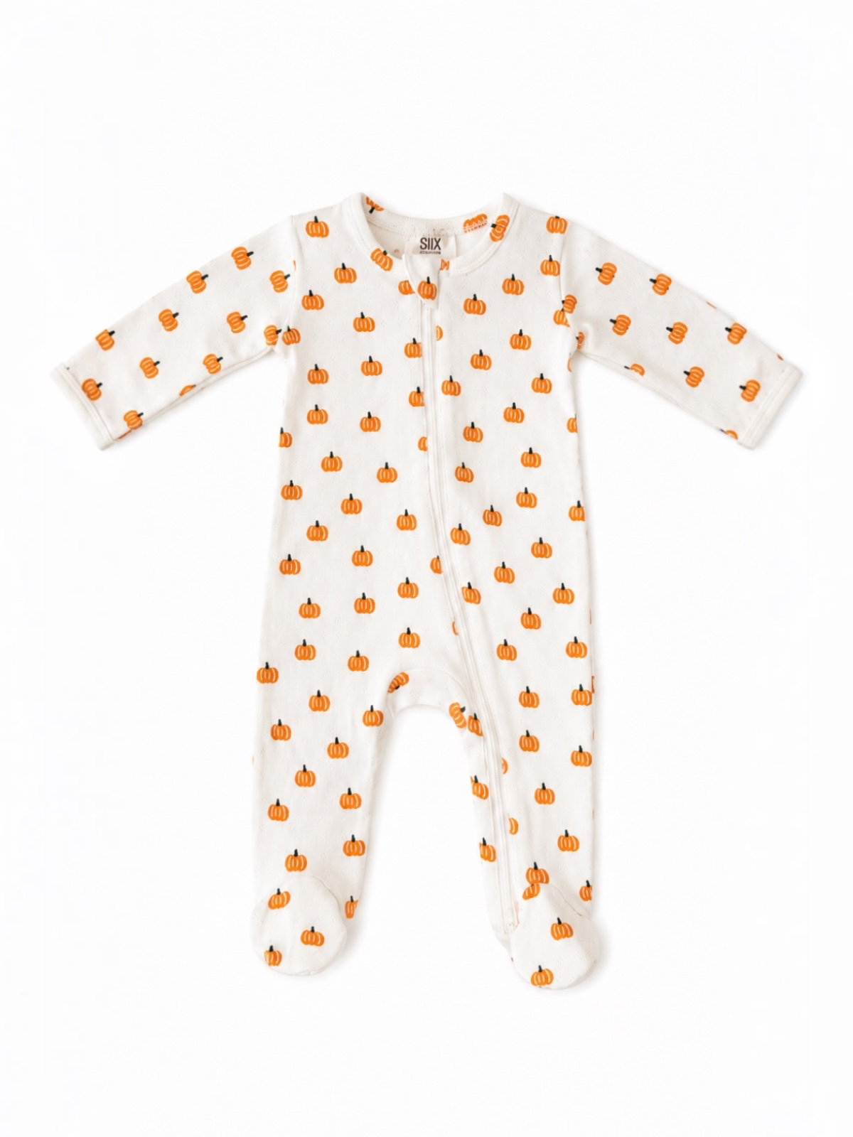 White baby sleeper with orange pumpkin pattern, featuring long sleeves and footed design. Perfect for fall.