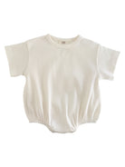 White ribbed baby onesie with short sleeves and elasticized bottom.