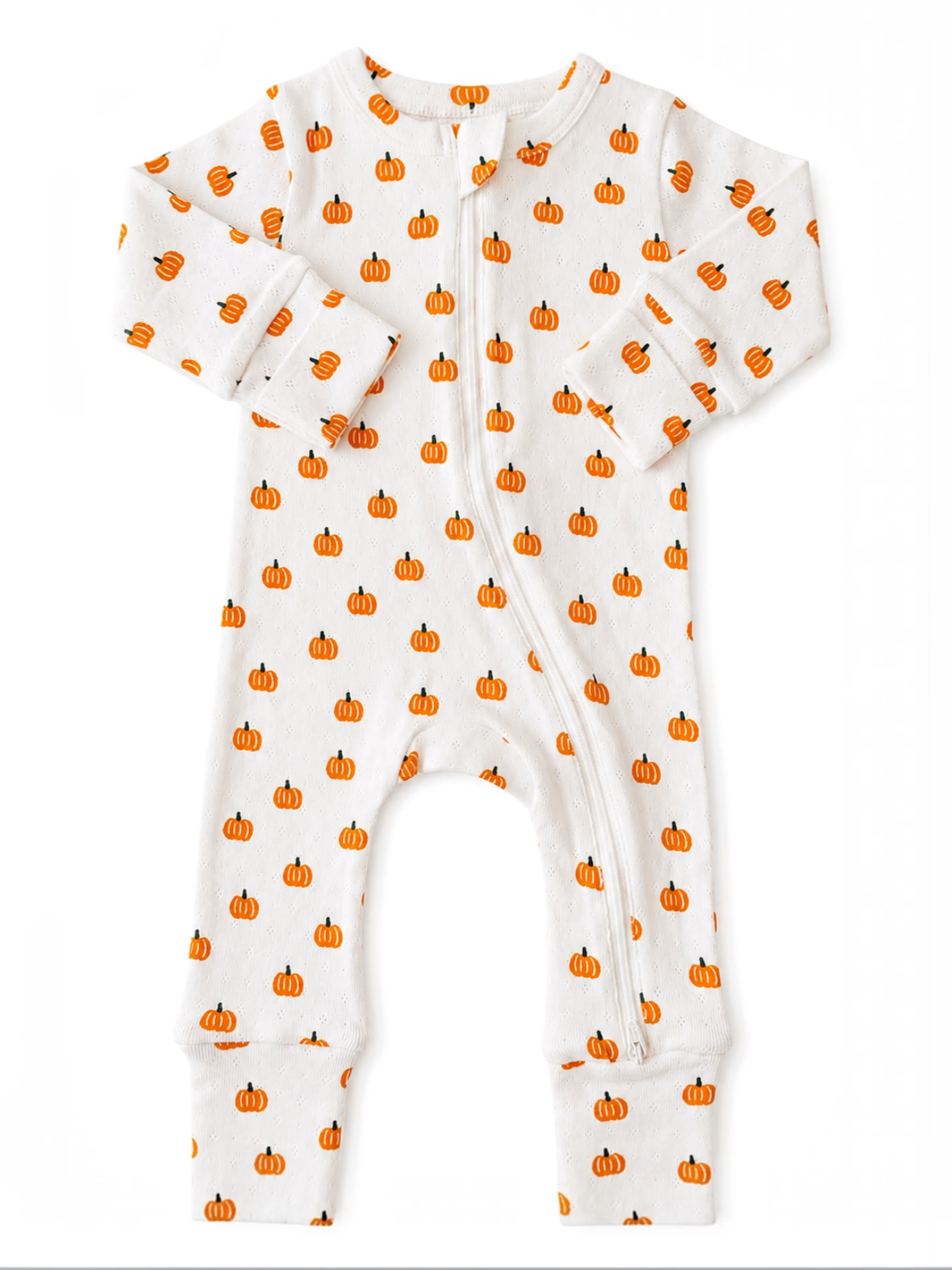 White pajama onesie with orange pumpkin prints, featuring long sleeves and a front zipper closure.