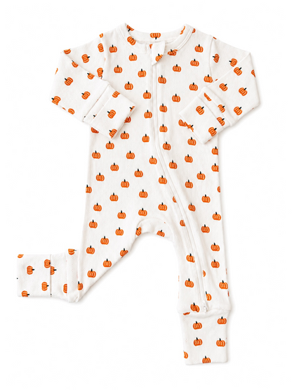 White baby onesie with orange pumpkin patterns, featuring long sleeves and a front zipper. Ideal for cozy autumn wear.
