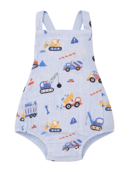 Blue baby romper with colorful construction vehicle patterns, featuring excavators, trucks, and tools.