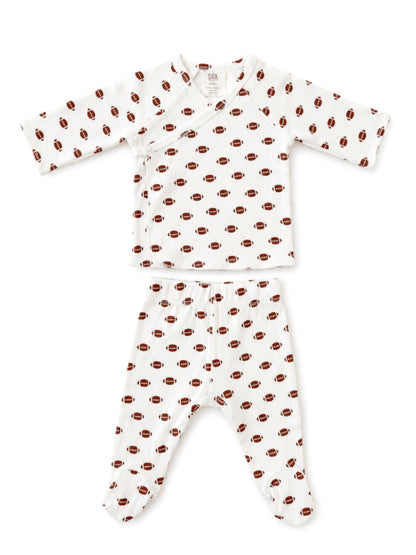 Baby outfit featuring a long-sleeve top and pants with a football pattern on a white background.