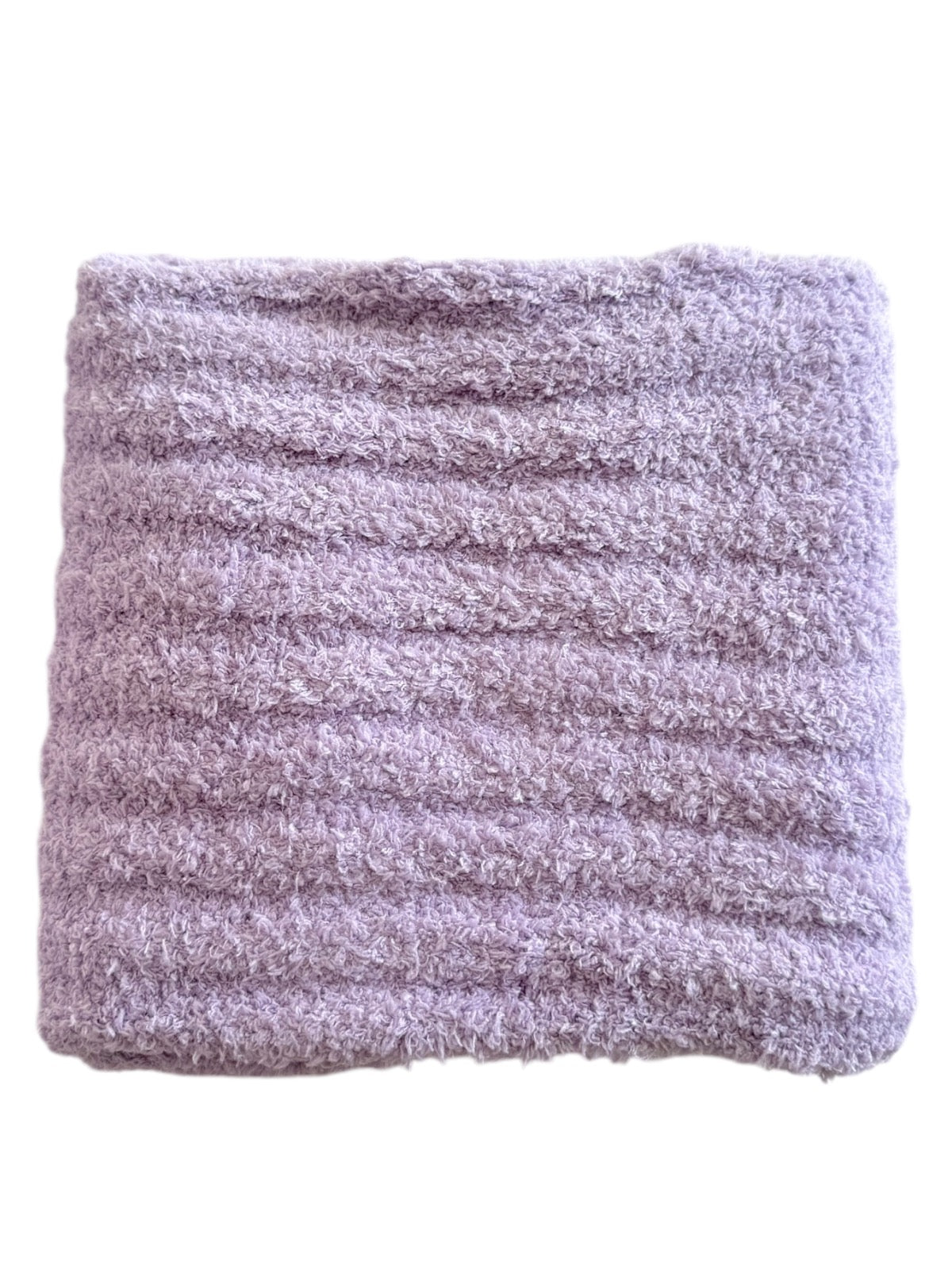 Soft lavender plush blanket with textured ribbed pattern. Perfect for cozying up or adding comfort to any space.