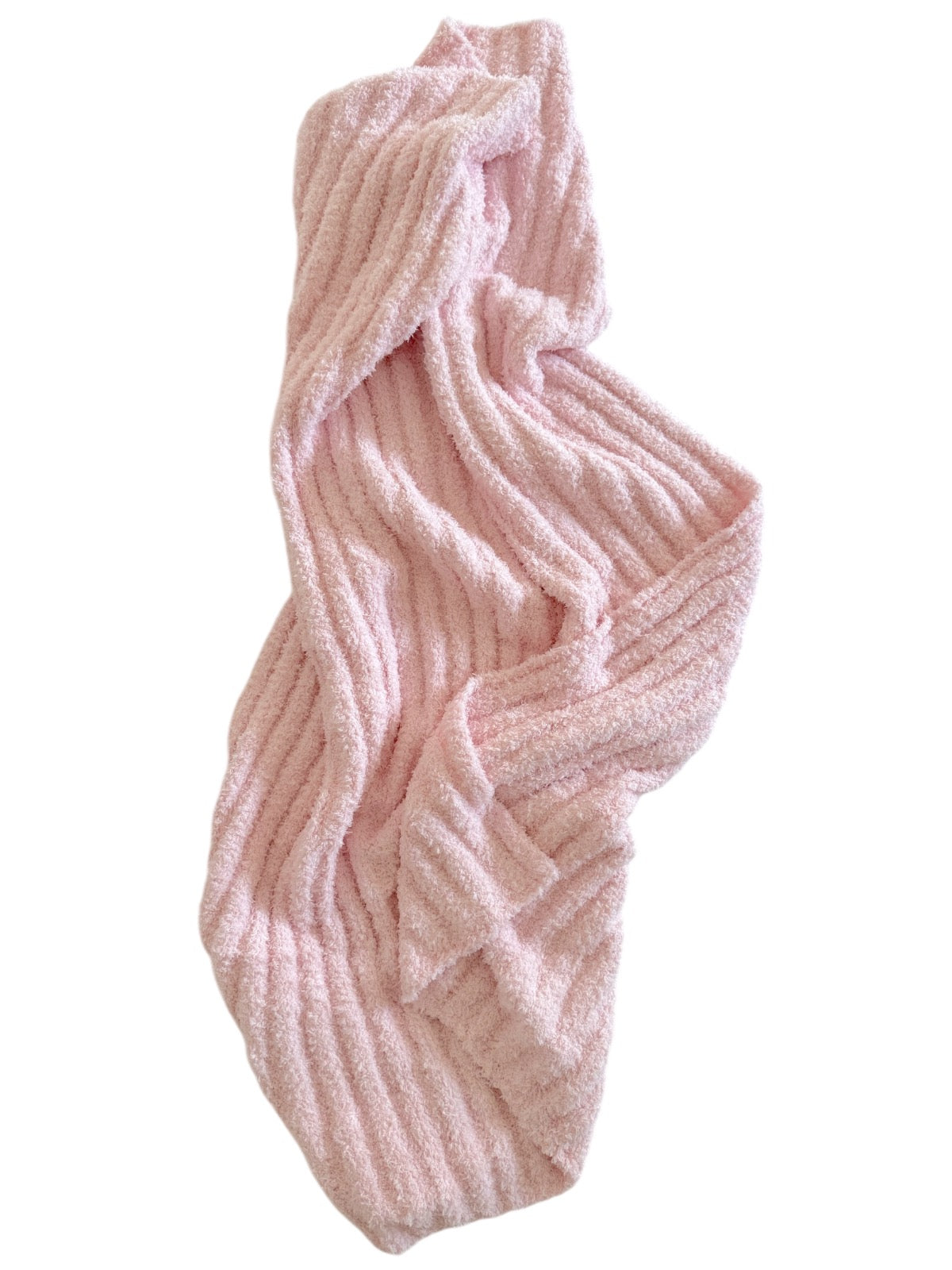 Soft pink textured towel draped casually, showcasing a cozy and inviting appearance.