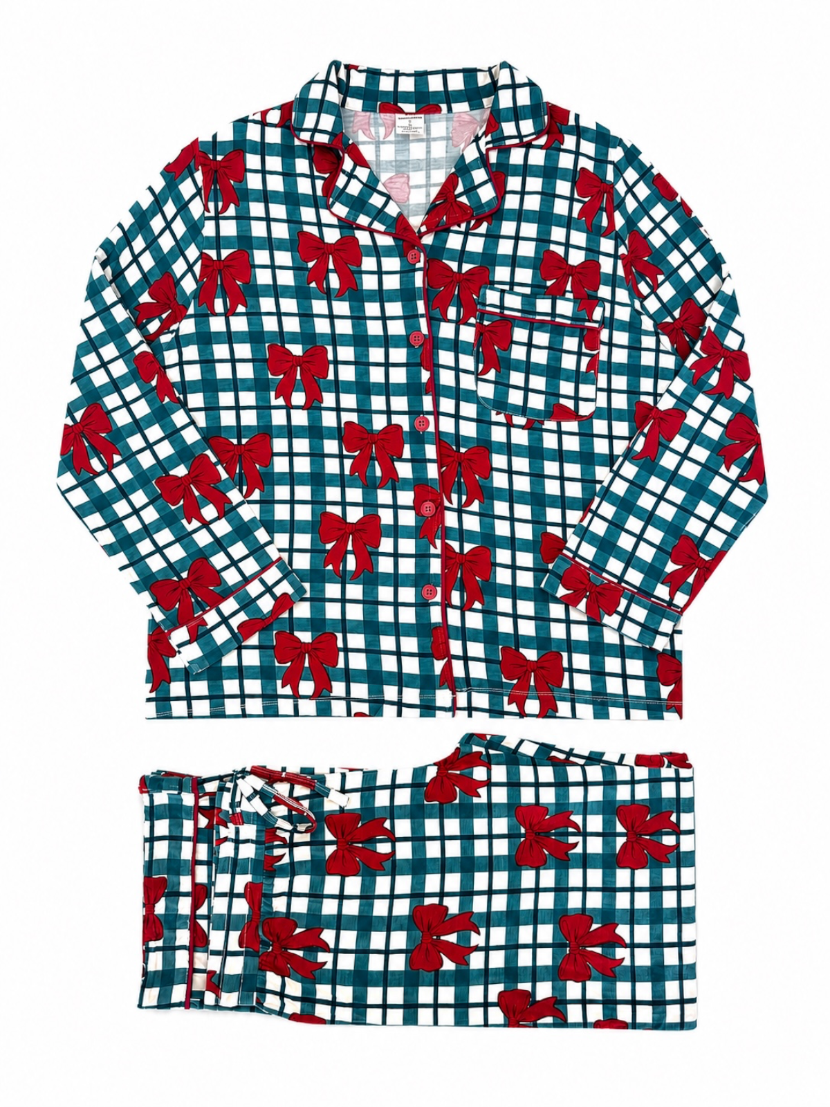 Red bow-printed pajama set on a green and white checkered background, featuring a button-up top and matching pants.