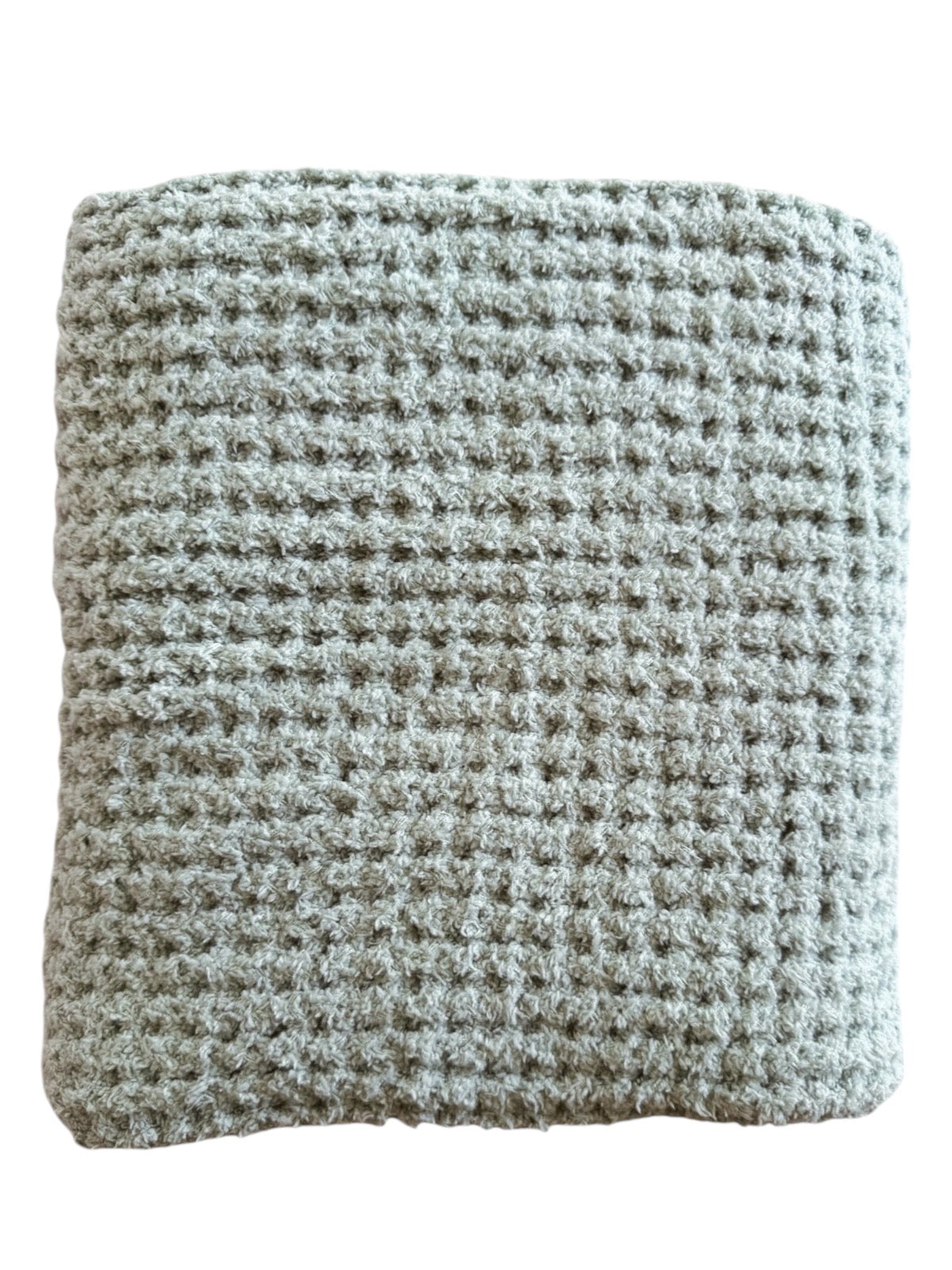 Textured gray blanket folded neatly, showcasing a soft, woven pattern for cozy warmth and comfort.