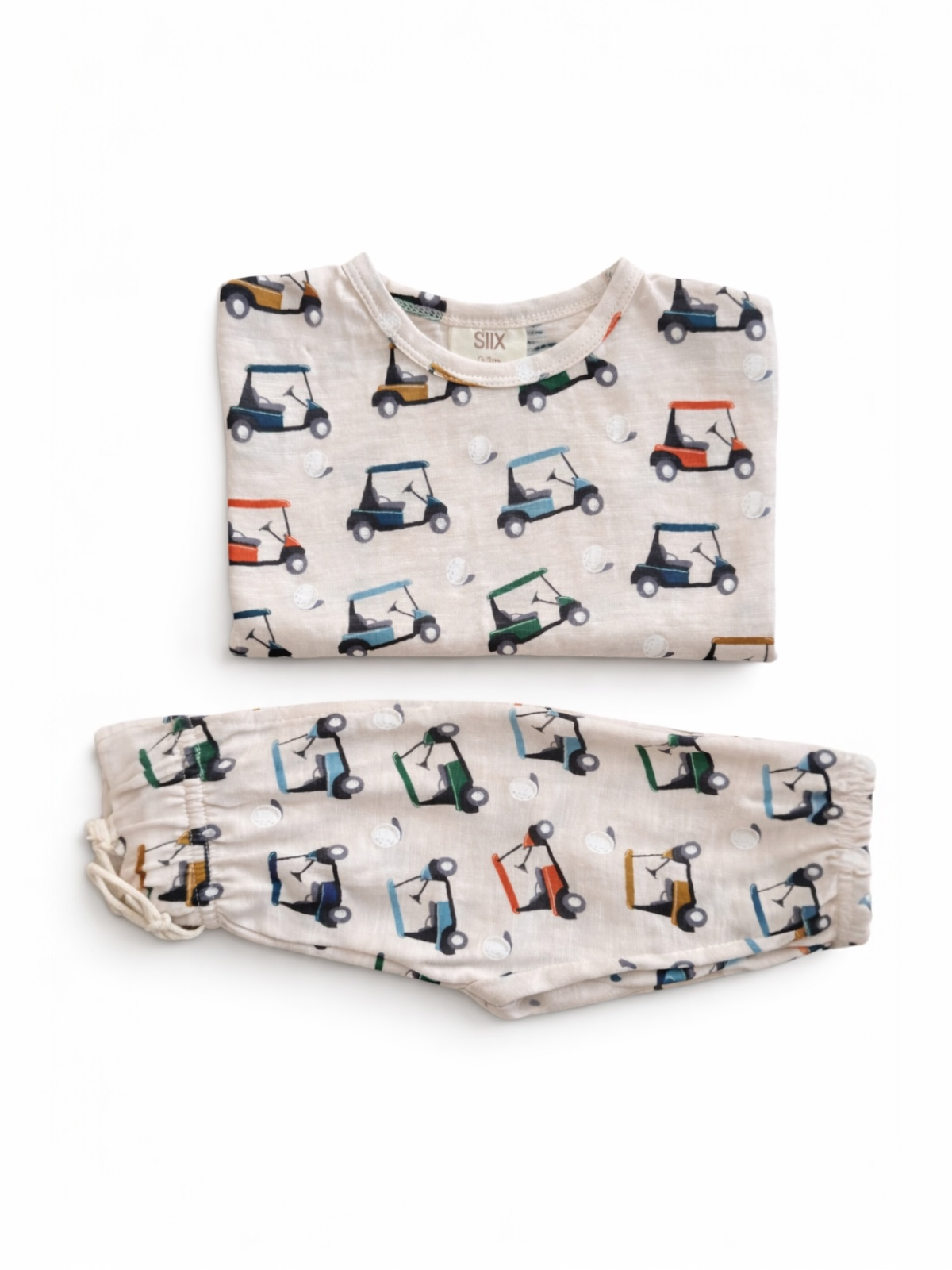 Children's pajama set featuring golf cart prints on a light background, includes top and matching pants.