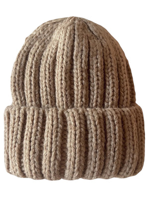 Tan knitted beanie with a ribbed texture, folded brim, and soft, cozy appearance.